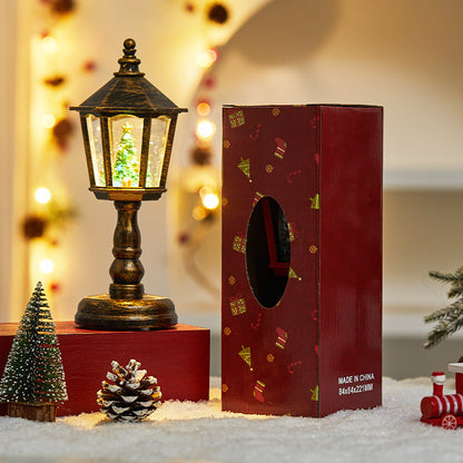 Huisvormige ledlamp als kerstdecoratie op tafel