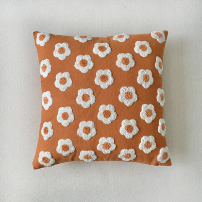 Vierkante kussenhoes met jacquard patroon en borduursel in close-up