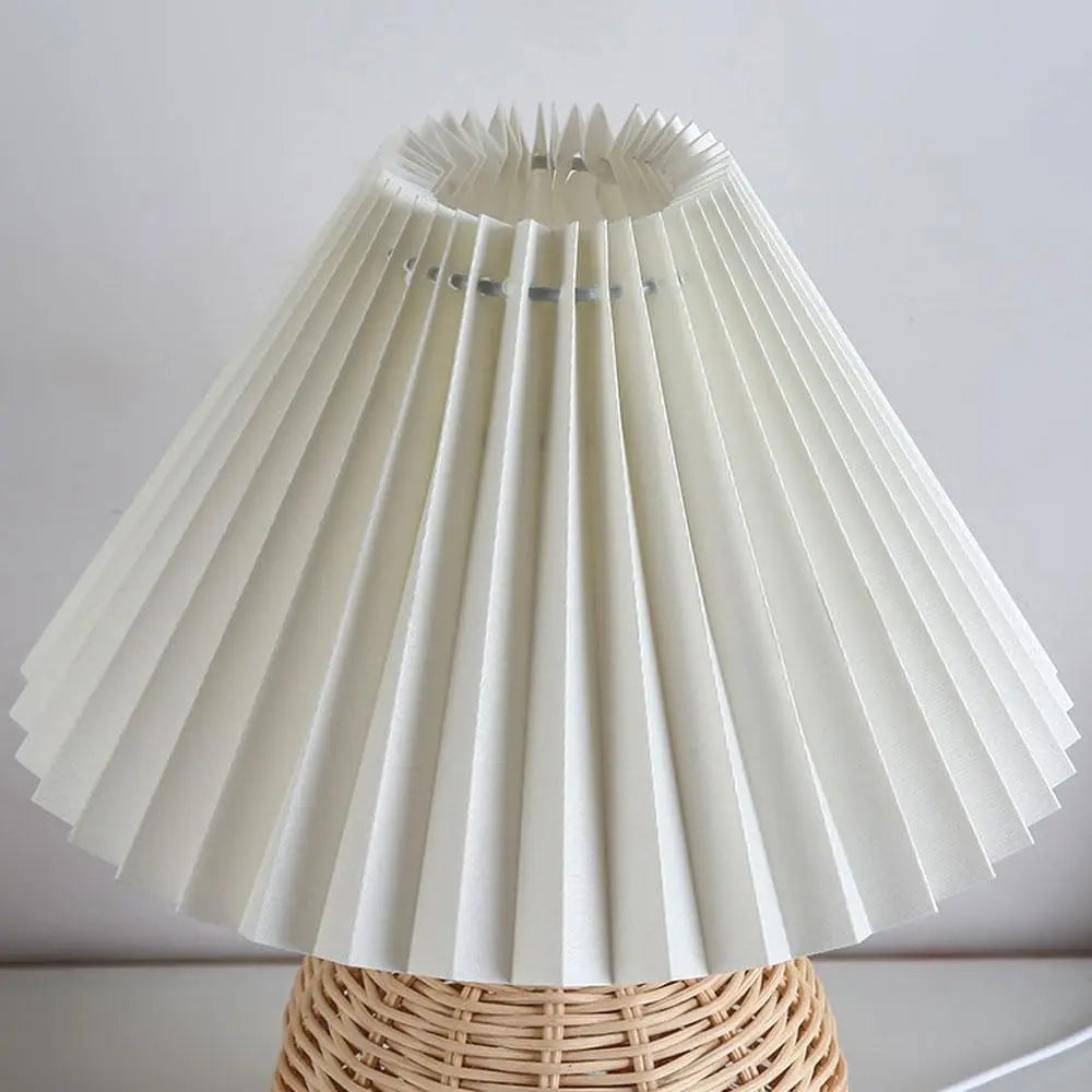 vlechtwerkaccent aan de voet van de bedlamp