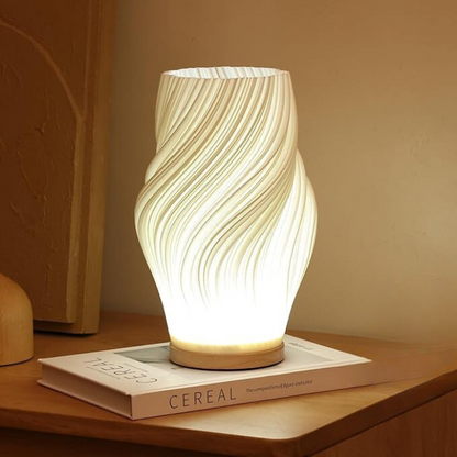 Stijlvolle LED tafellamp met gebogen silhouet en zachte lichtuitstraling