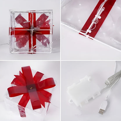 Transparante decoratieve dozen met rode linten als sfeervolle set