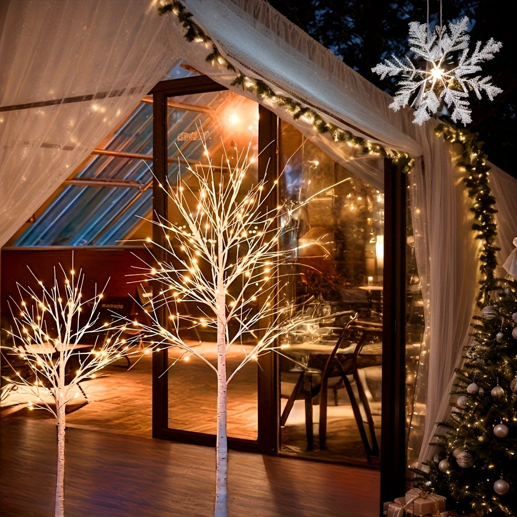 warm wit verlichte takken van een decoratieve lichtboom
